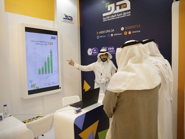 HRDF employees answer visitors' inquiries